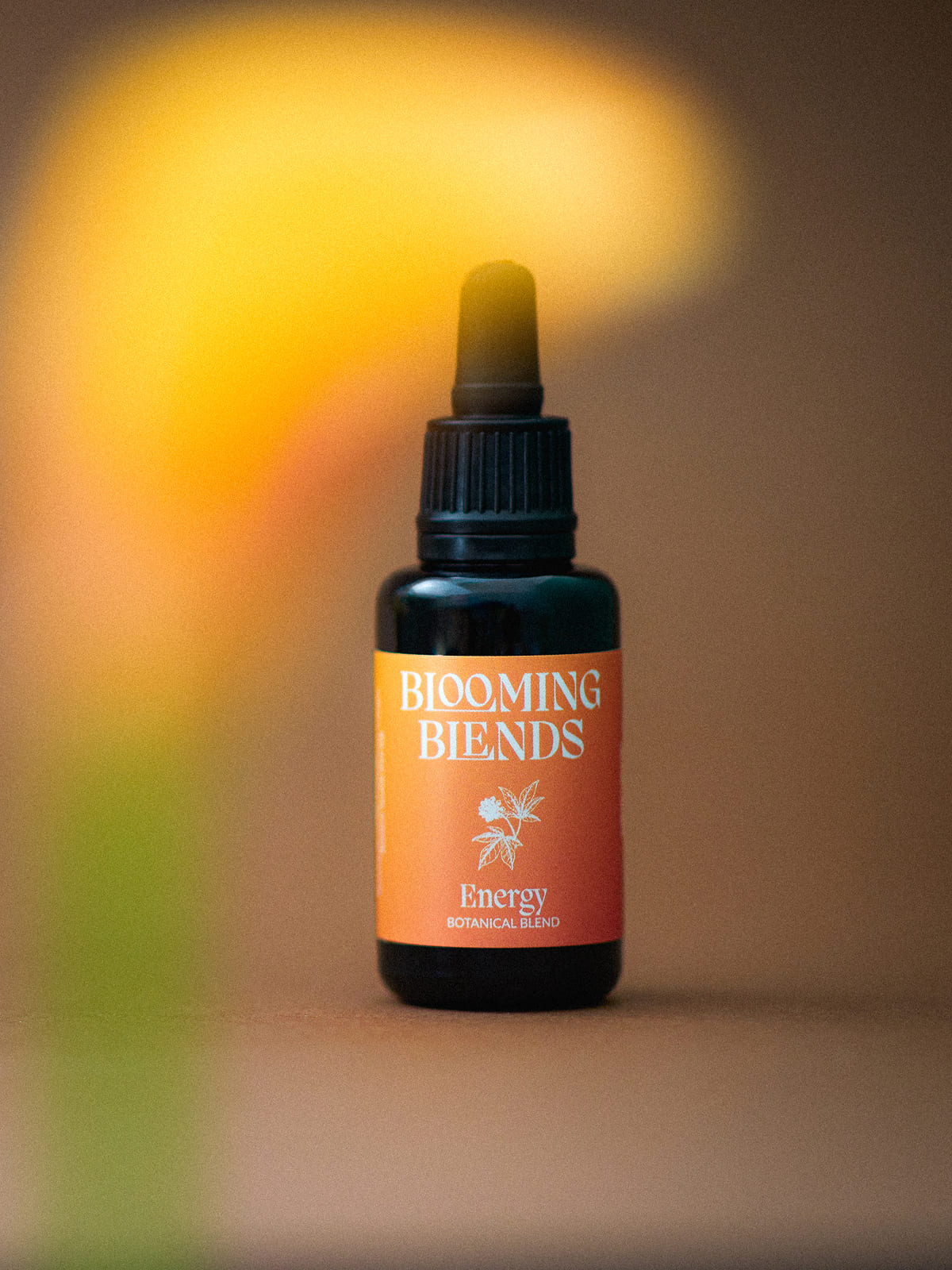 Blooming Blends Nighttime herbal tincture box held in a hand.
